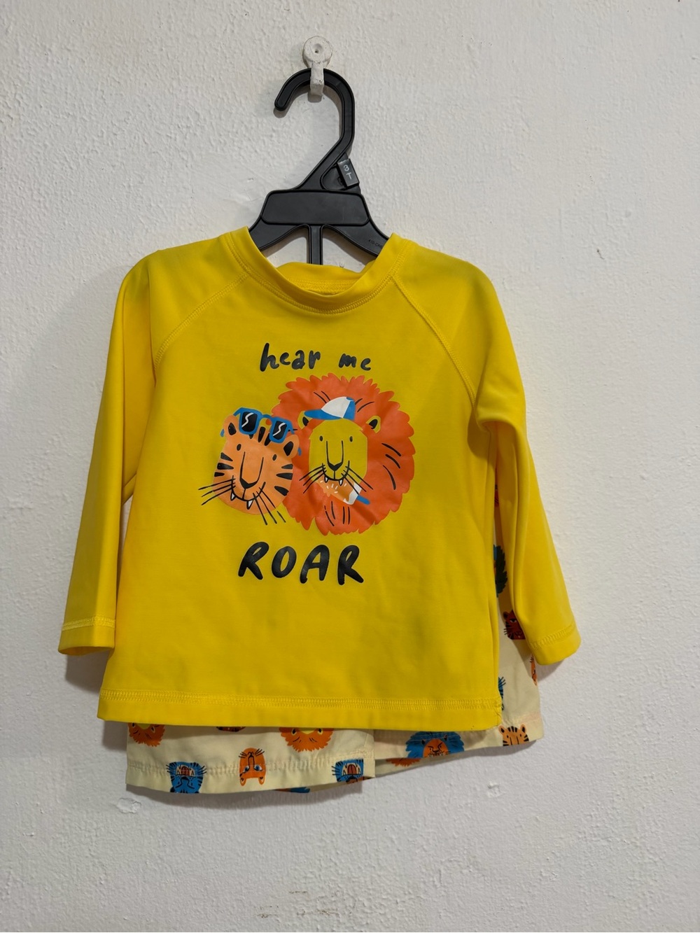 Baby Yellow Lion Graphic Long Rashguard and swim trunks set.
